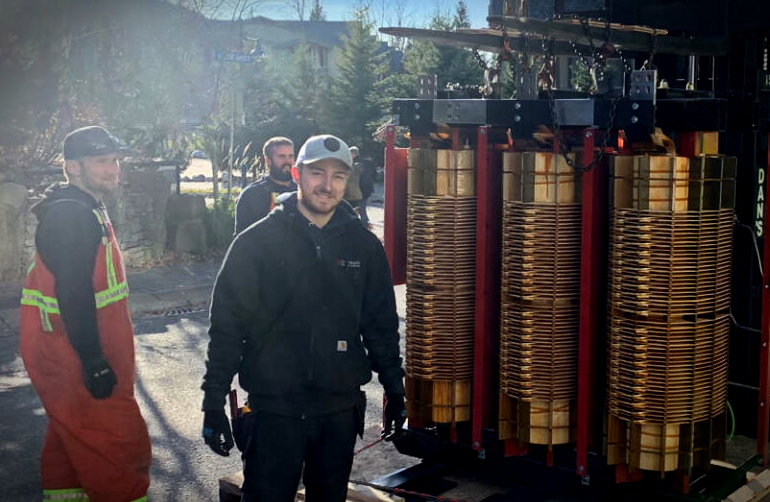 Commercial electricians working on an active job site